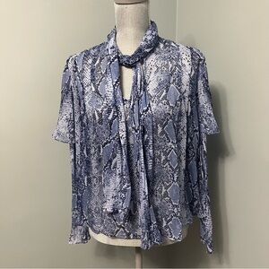 DIANE VON FURSTENBURG blue flowy blouse semi sheer women’s size 4 animal print